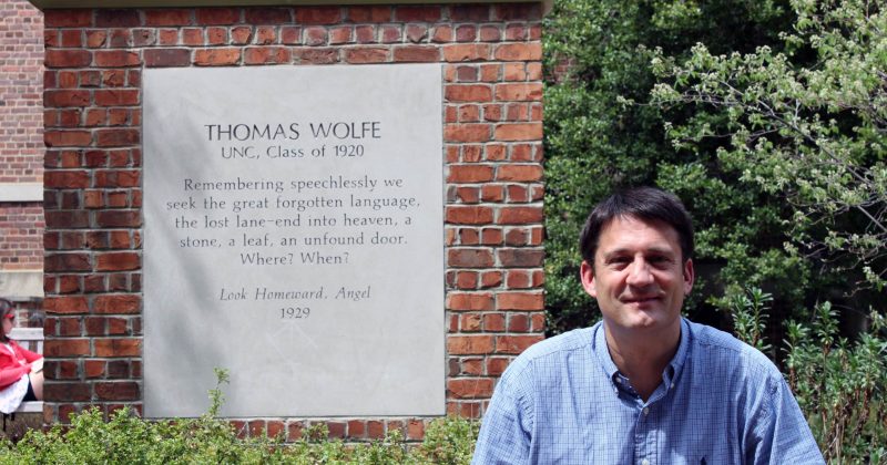 UNC historian Fitz Brundage in front of the Thomas Wolfe Memorial on UNC’s campus,