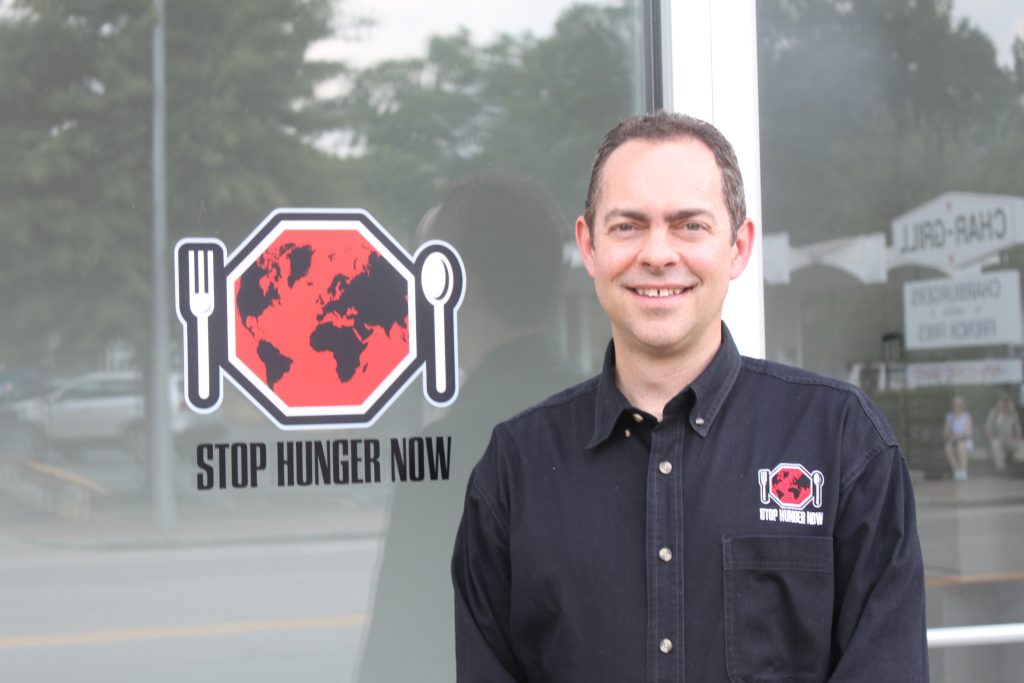 Rod Brooks in front of Stop Hunger Now
