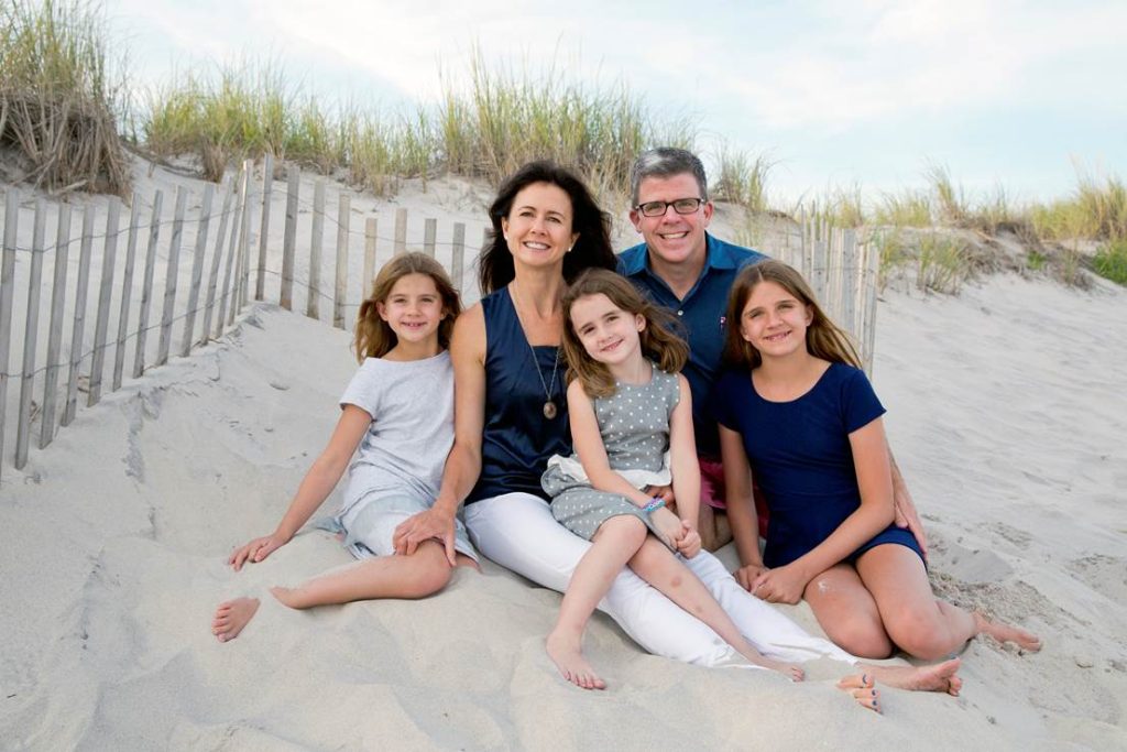 Vicki and David Craver with their daughters at the beach