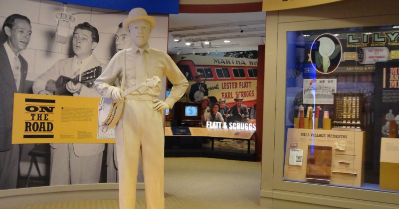 A statue of Earl Scruggs greets visitors at the entrance of the Earl Scruggs Museum