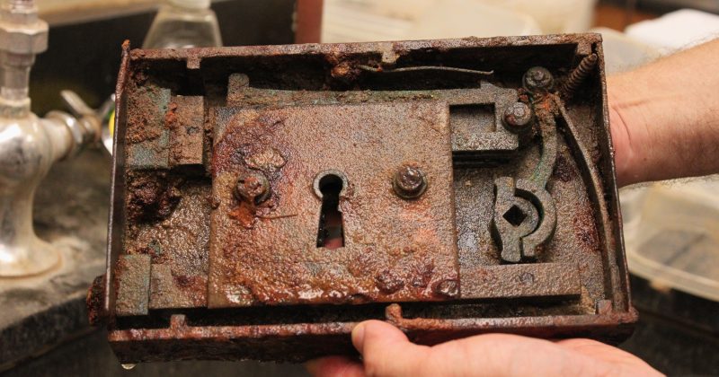 An old and rusted lock mechanism from President Caldwell