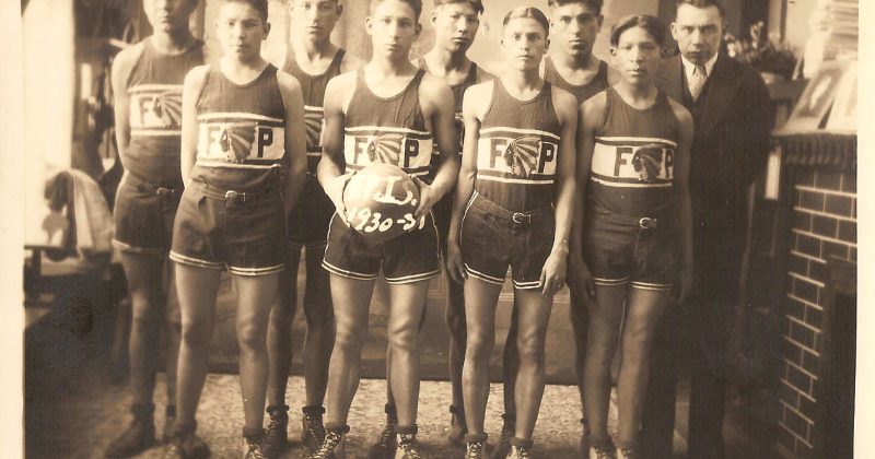 Henry owl with a boys basketball team, 1930-31