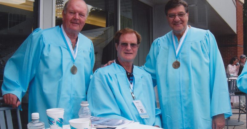 Joe Quigg, Bob Young and Lennie Rosenbluth wear Carolina blue graduation gowns at a reunion event