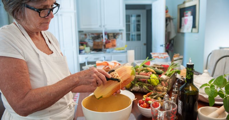 Food stylist Elizabeth Hensley prepares a papaya salad for the cover photo shoot.