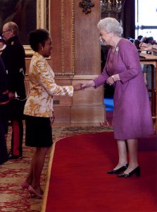 Golding is appointed an Officer of the Order of the British Empire by Queen Elizabeth II. (Photo courtesy of Peaches Golding)