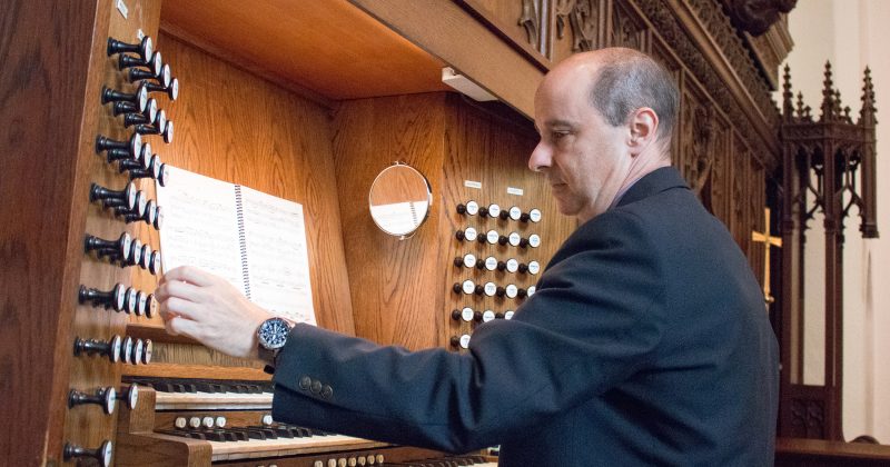 Andy Lang plays the organ in Chapel of the Cross on Franklin Street