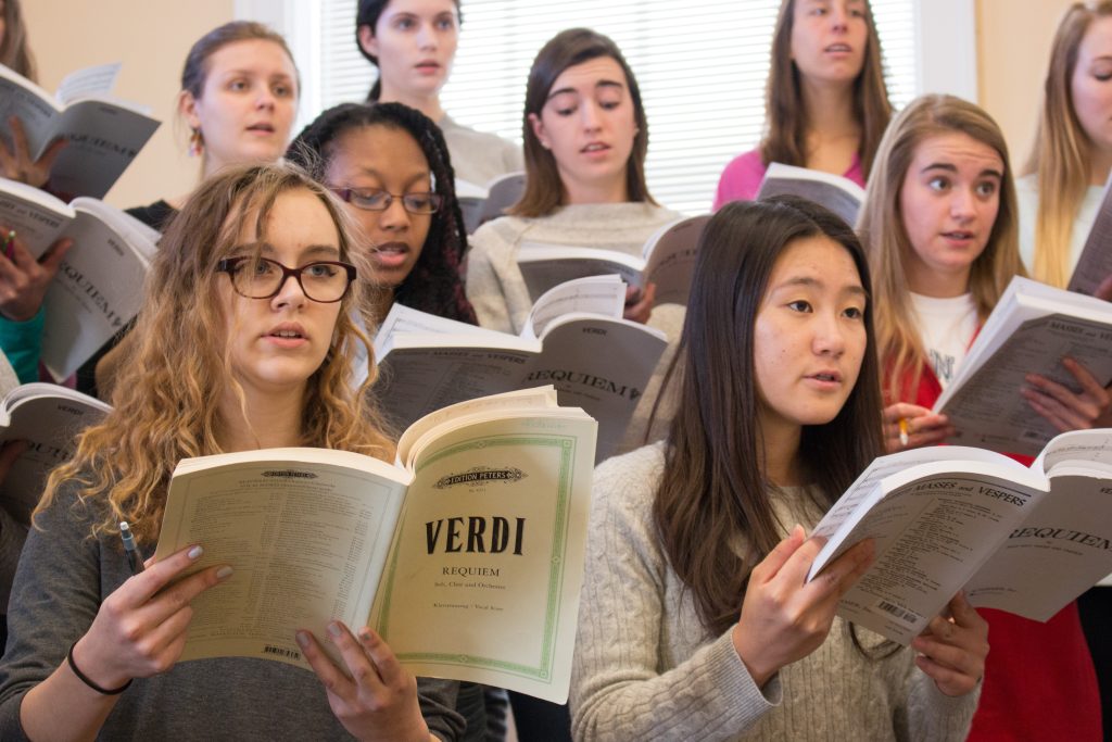 Members of the Carolina Choir sing from Verdi Requiem in a rehearsal