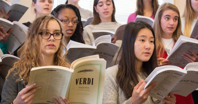 Members of the Carolina Choir sing from Verdi Requiem in a rehearsal