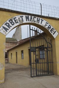 The translation of the inscription over the gate at Terezín is “Work will make you free.” (photo courtesy of Partisan Pictures)