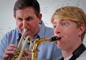 Jim Ketch and a student play instruments