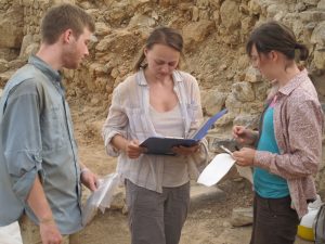 UNC classical archaeology Ph.D. student Cicek Beeby (center) works with trench assistants Zachary Lingle (chemistry, minor in archaeology ’15) and Mallory Melton (anthropology, archaeology ’14.