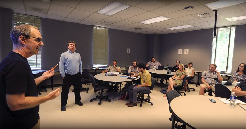 Dan Anderson, left, director of UNC’s Digital Innovation Lab, and Todd Taylor, director of the Writing Program, teach a hands-on workshop for English 105 instructors at the start of the fall semester. The session focused on how to design digital class projects.