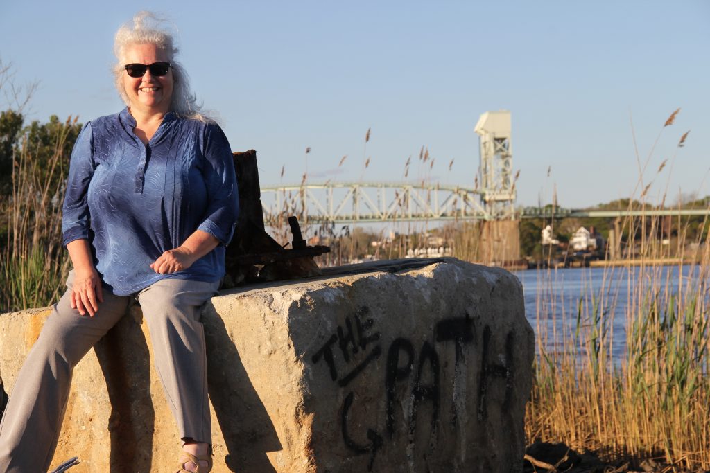Rachel Willis in front of the Cape Fear Memorial Bridge and Port of Wilmington