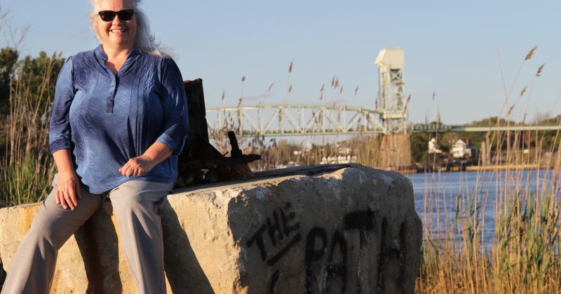 Rachel Willis in front of the Cape Fear Memorial Bridge and Port of Wilmington