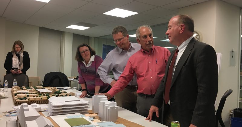 Kevin Guskiewicz, Ed Samulski, Chris Clemens and more look over early design concepts of the Institute for convergent Science