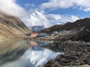 Cho Oyu, the sixth tallest mountain on Earth looms large in the background over the village of Gokyo by the shore of lake 3. (photo by Roberto Camassa)