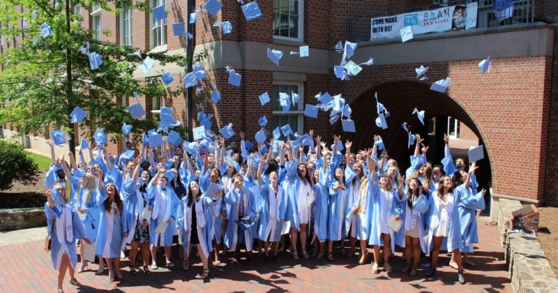 Environment and ecology graduates celebrate outside Murray Hall in spring 2018.