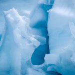 Blue glacier ice inside a crevasse