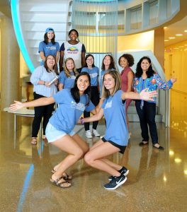 Summer 2019 Cumpston Fellows and leaders celebrate in the Genome Sciences Building at an orientation event for first-generation students during the first week of fall classes. (photo by Donn Young)