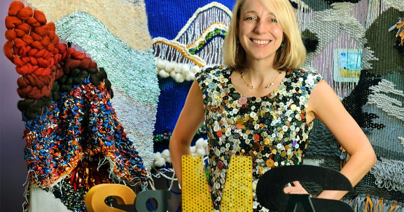 Sarah George-Waterfield wore this button dress she crafted for an innovative Ph.D. dissertation project to her May doctoral hooding ceremony.