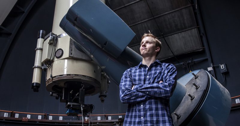 Ben Kaiser standing in the Morehead Observatory
