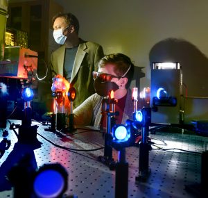Gerald Meyer and Rachel Bangle in the laser lab in Murray Hall.