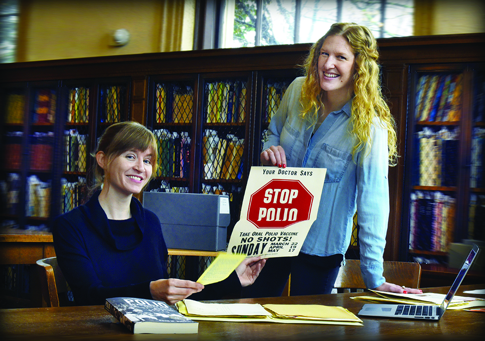 Susie Penman (left) and Caroline Efird in Wilson Library.