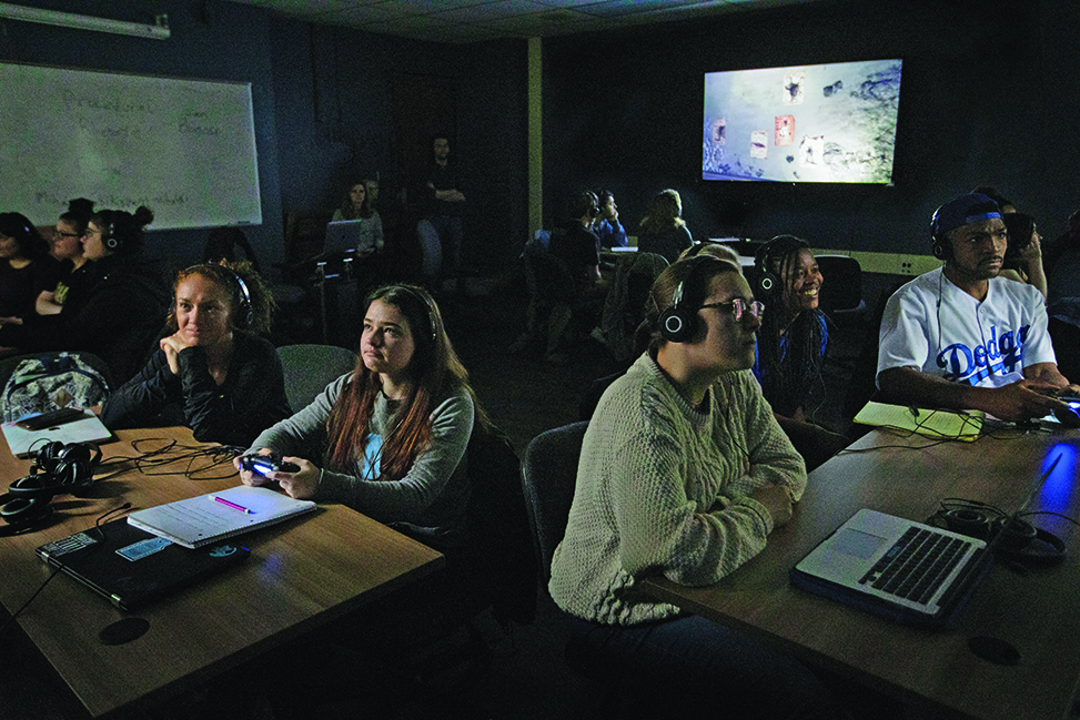 Students play "Layers of Fear" during their "Horror and the Global Gothic: Film, Literature, Theory" class in the Greenlaw Gameroom on January 31, 2020. (Megan May/UNC Research)
