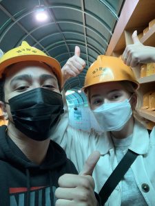 Going down the Third Tunnel at the Demilitarized Zone. Ridley and friend in hard hats.