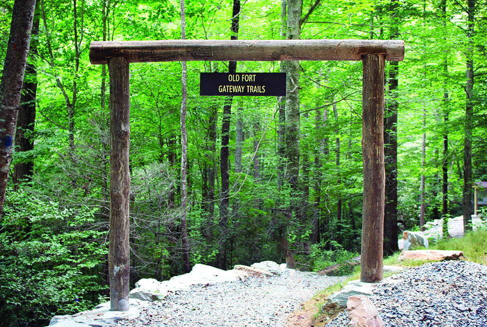 The arched sign to the Old Fort Gateway trails.