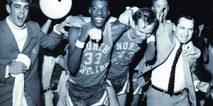 Charlie Scott (#33), Rusty Clark (#43) and Dean Smith. (News & Observer file photo).