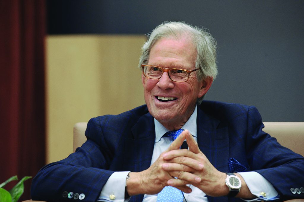 Peter Grauer smiles as he gives a lecture in the FedEx Global Education Center.