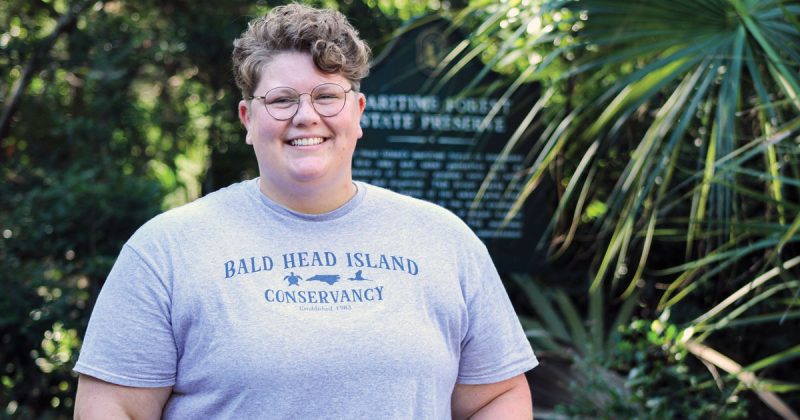 Headshot of Kimmy Hansen, who's wearing a shirt that says "Bald Head Island Conservancy"